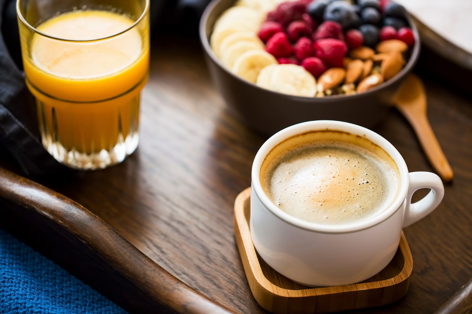 Coffee, orange juice and oatmeal on a hotel breakfast tray