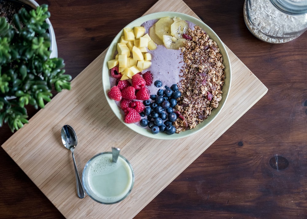 Healthy meal of acai bowl and matcha latte