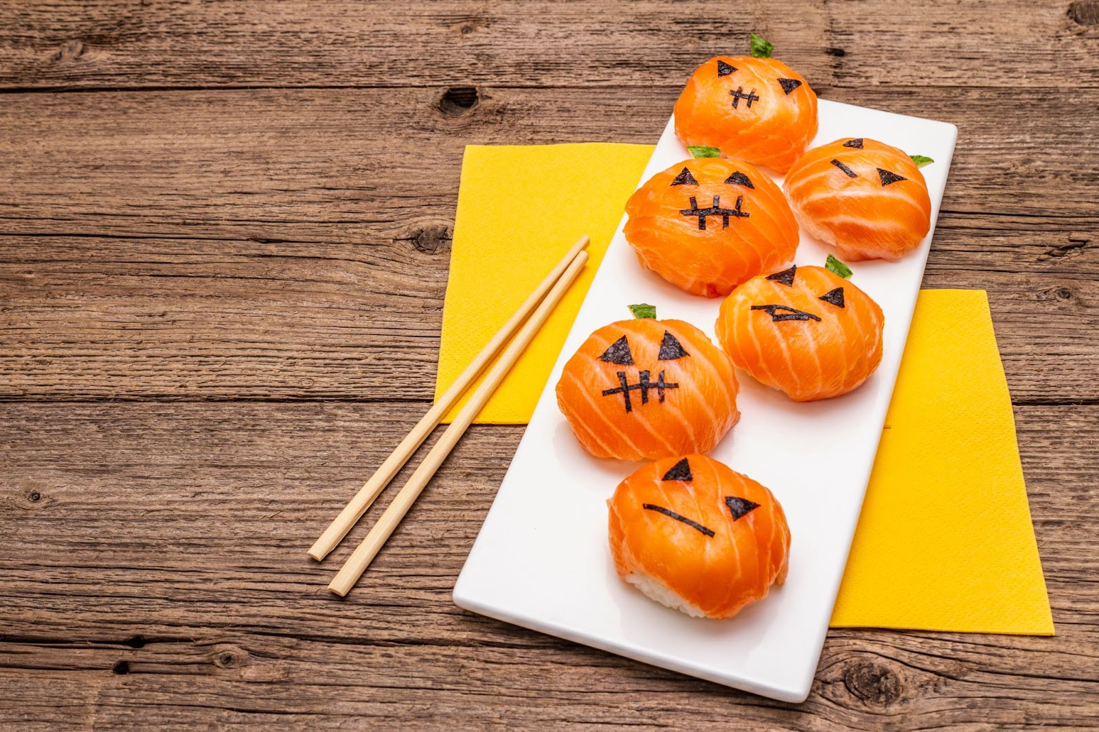 Salmon sushi created to look like jack-o-lanterns