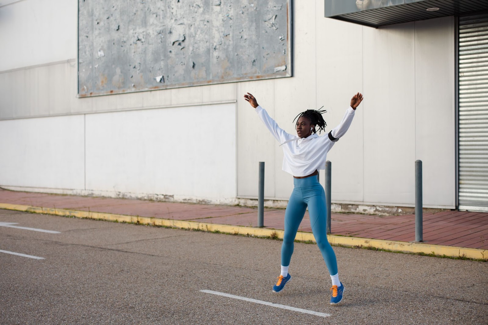 Woman doing a jumping jack Boot Camp exercise