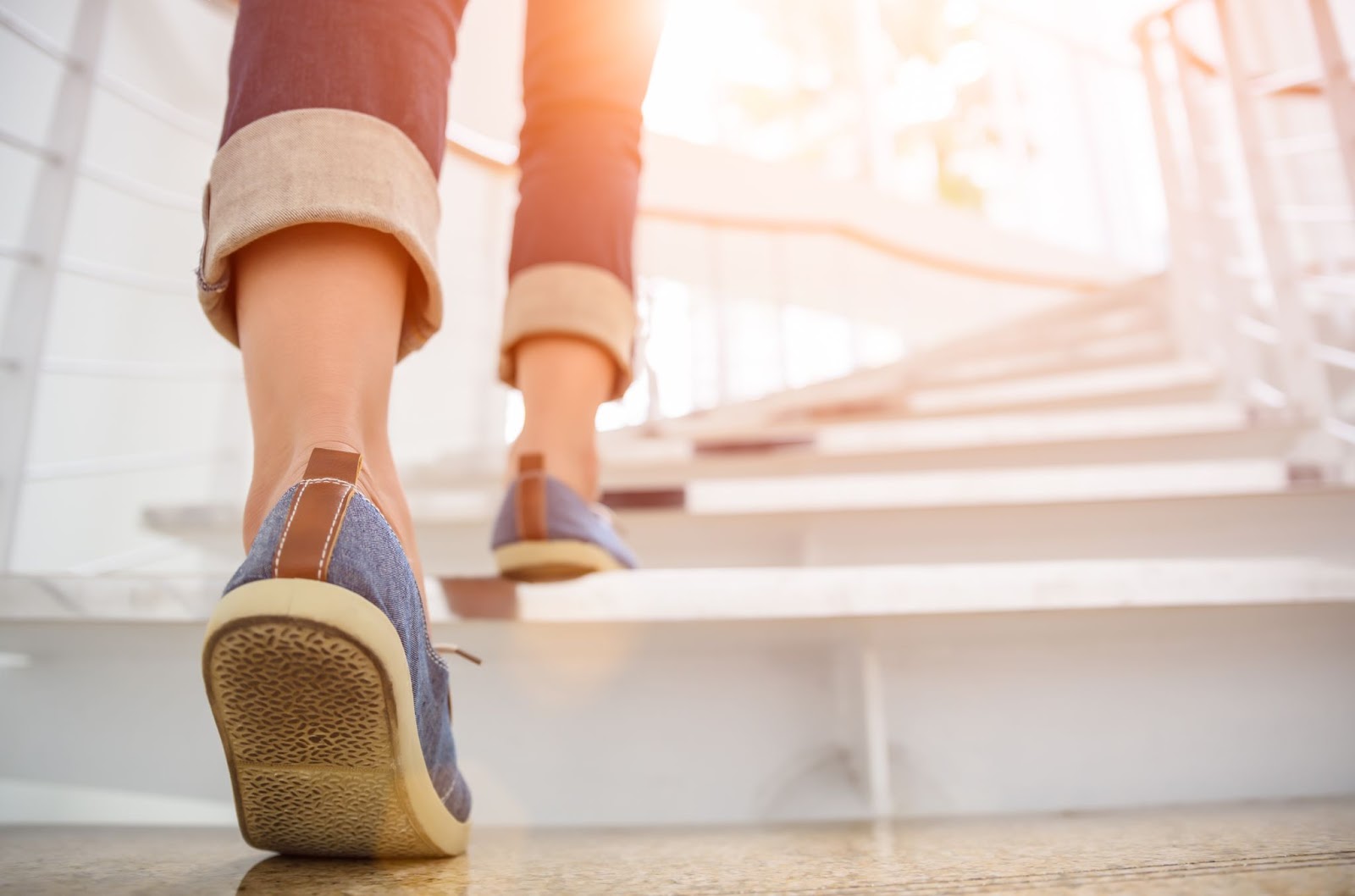 Closeup of woman walking up stairs