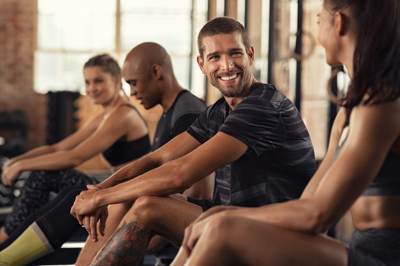 Fitness class resting during a virtual exercise class