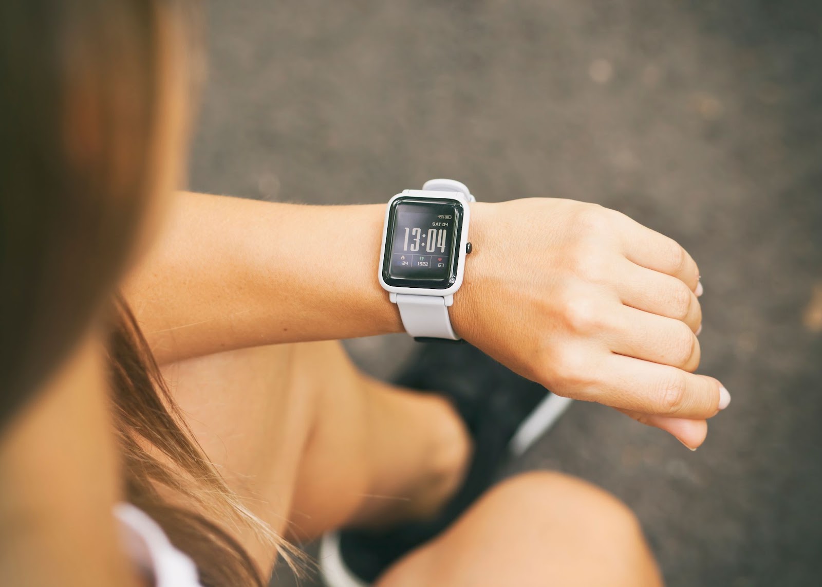 Woman checking her step count on her smart watch