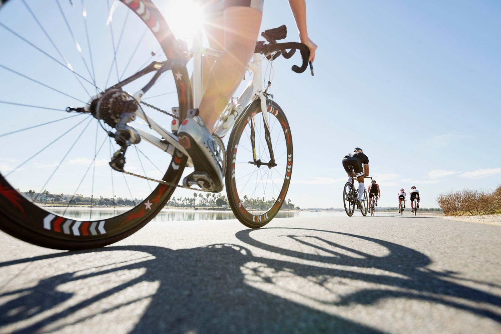 People riding a bike along the pier in San Diego, California