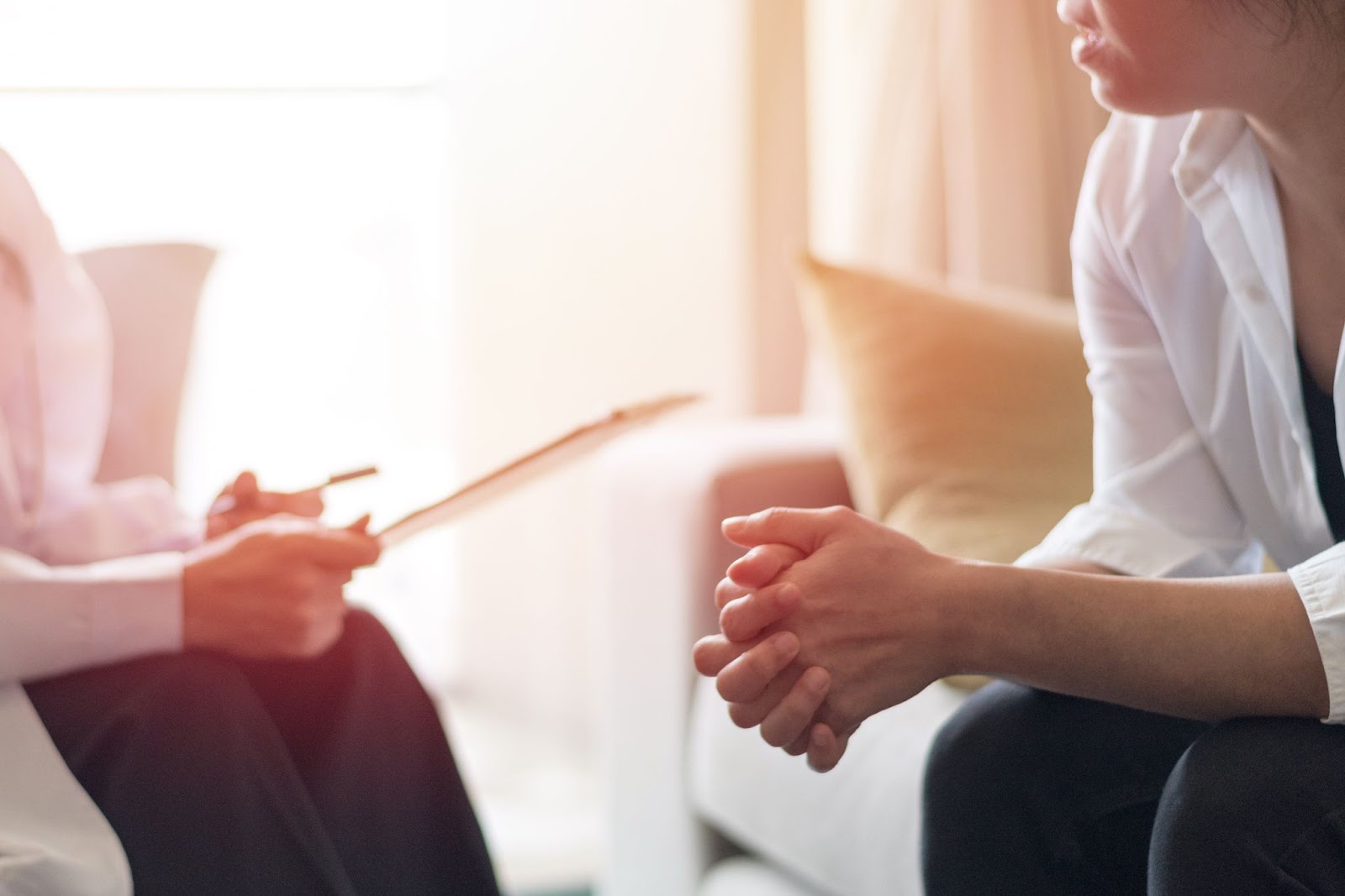 Young woman sitting in a therapist’s office