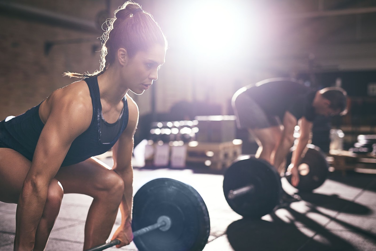 Fit, muscular woman performing a squat