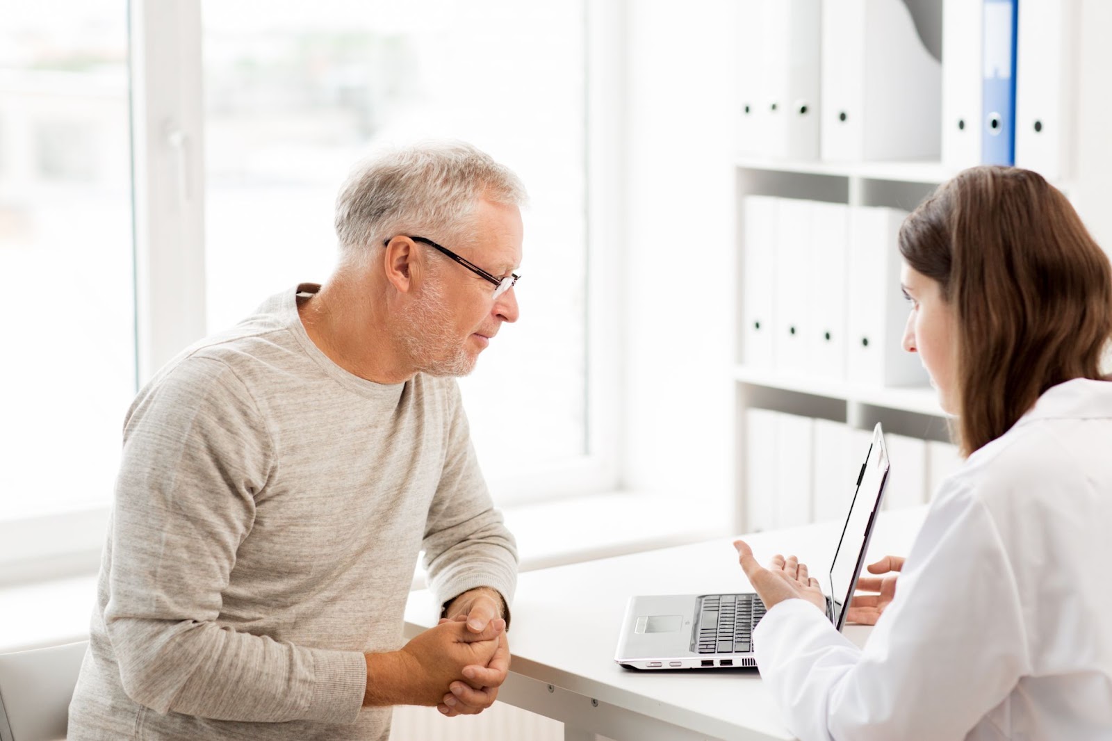 Older man talking to his primary care physician