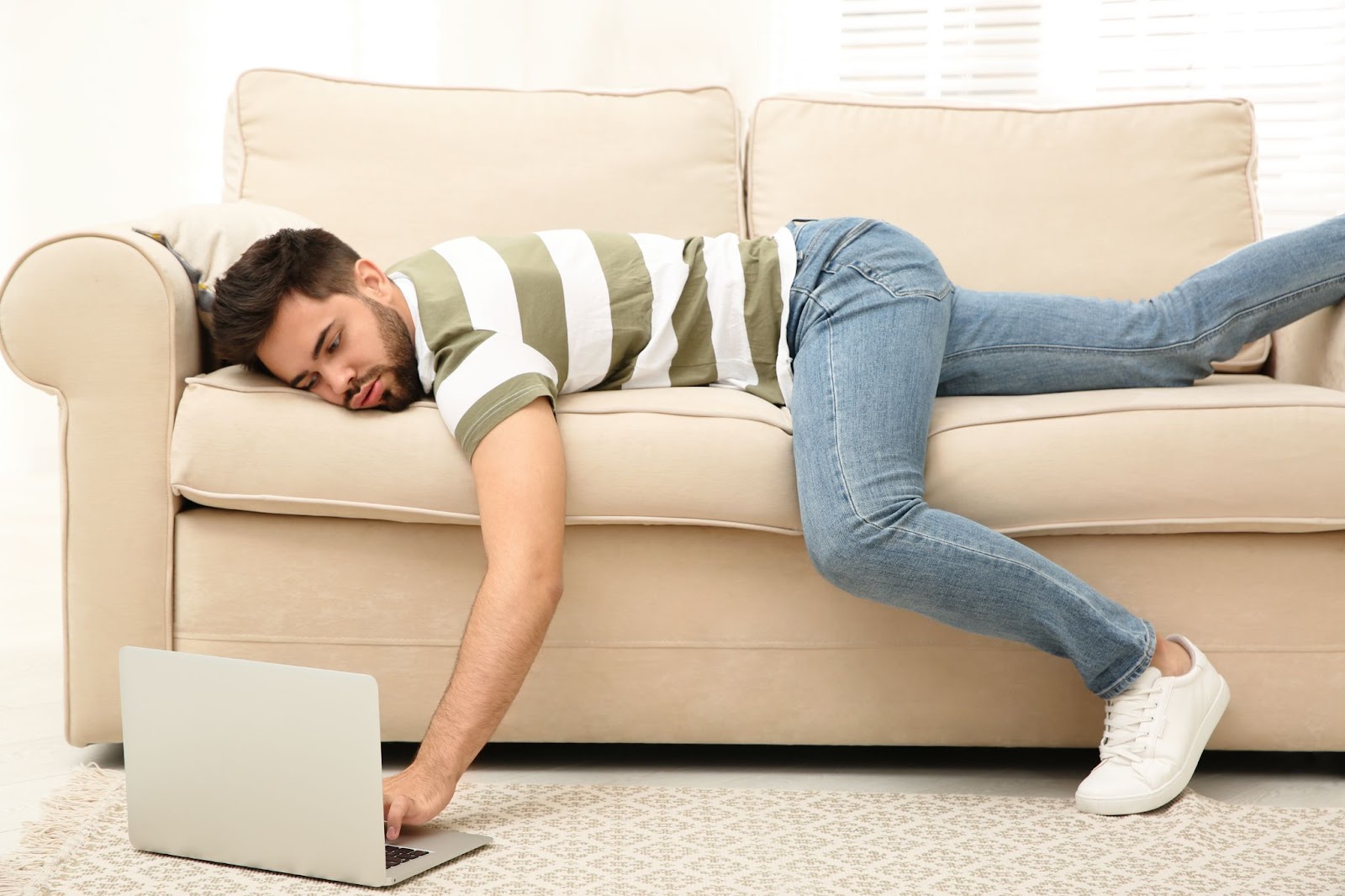 Lazy man laying on a couch