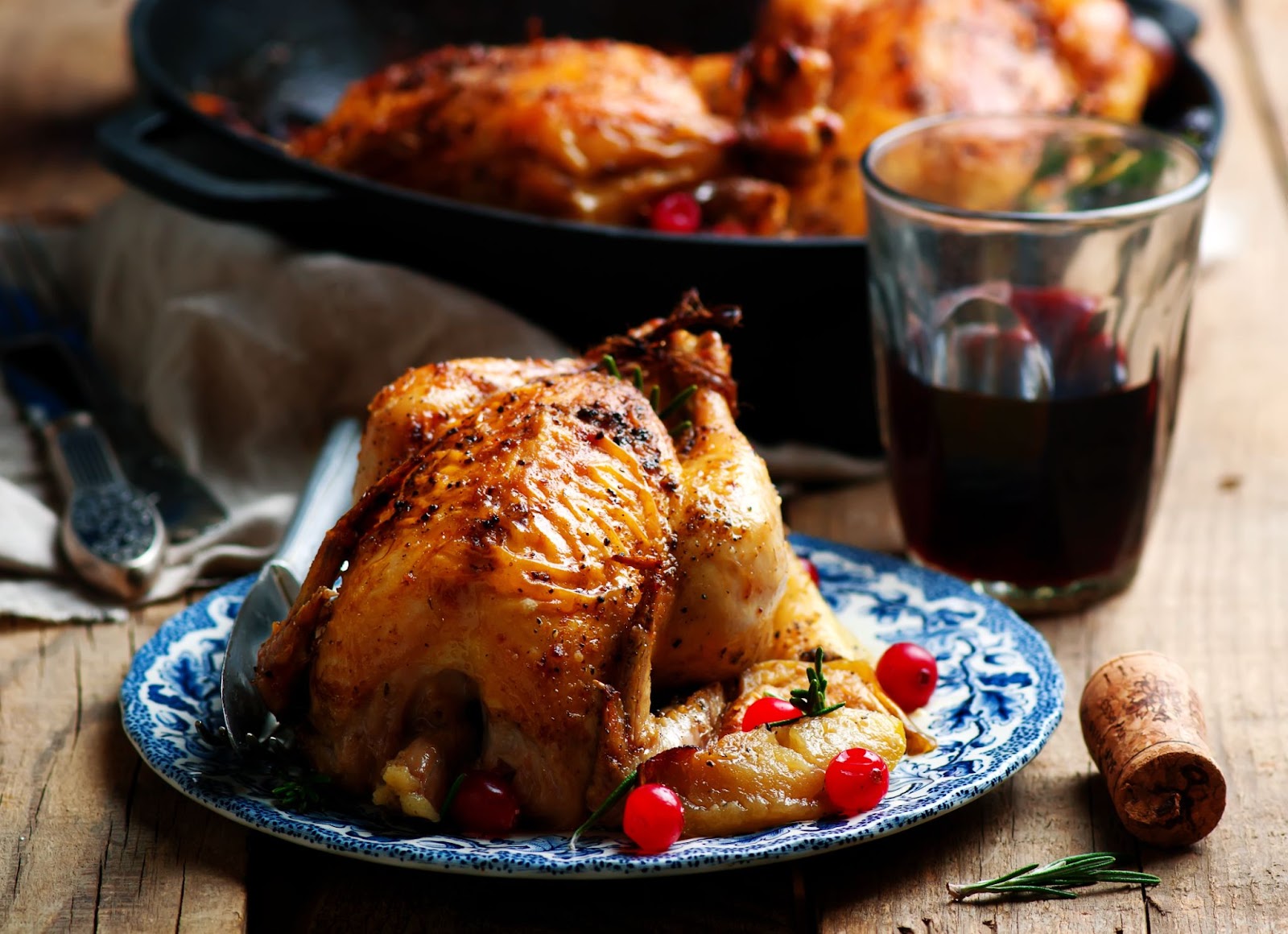 Cranberry Apple Stuffed Cornish Hens with a holiday background