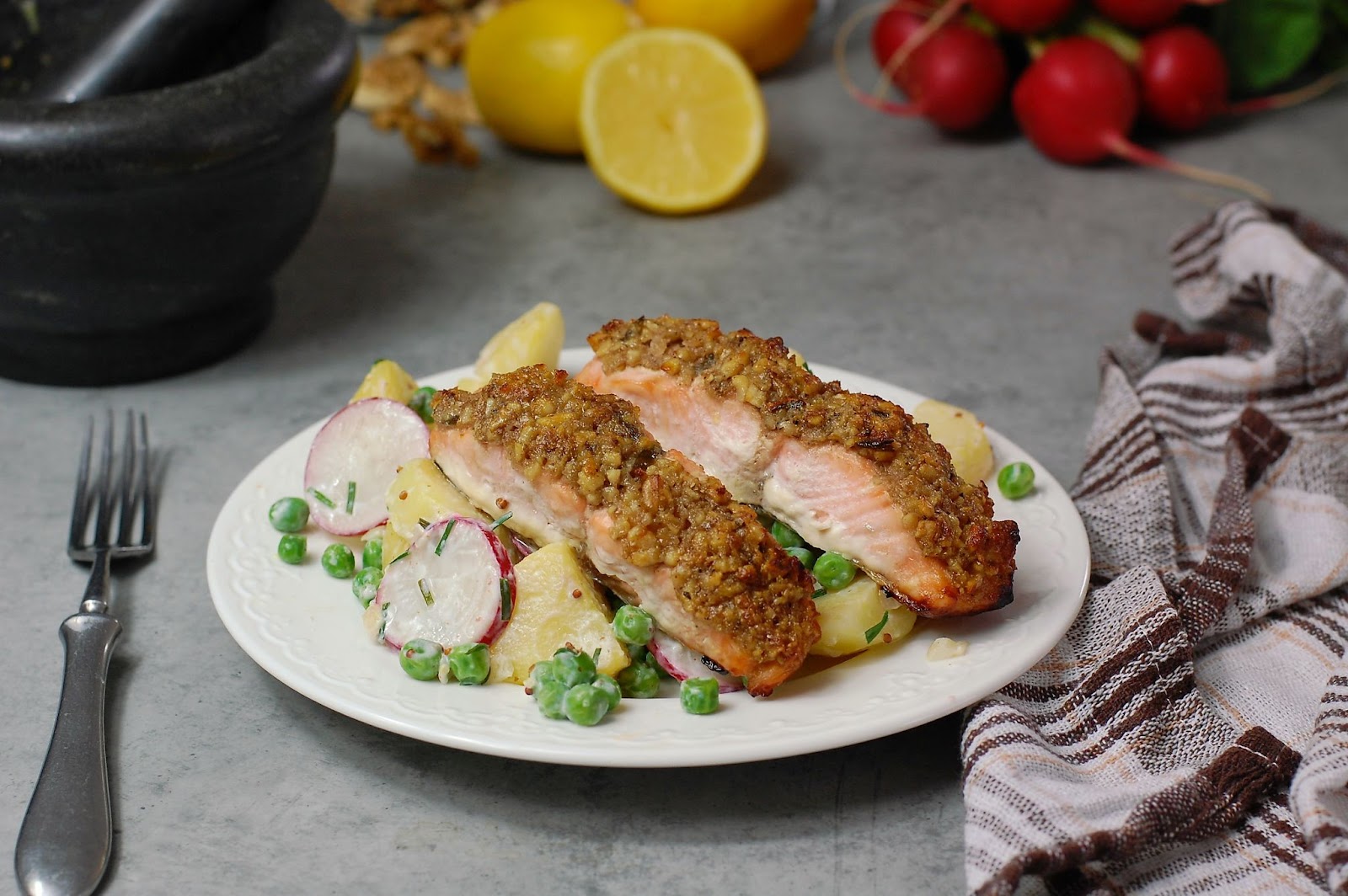 Image of salmon cooked with walnuts on top
