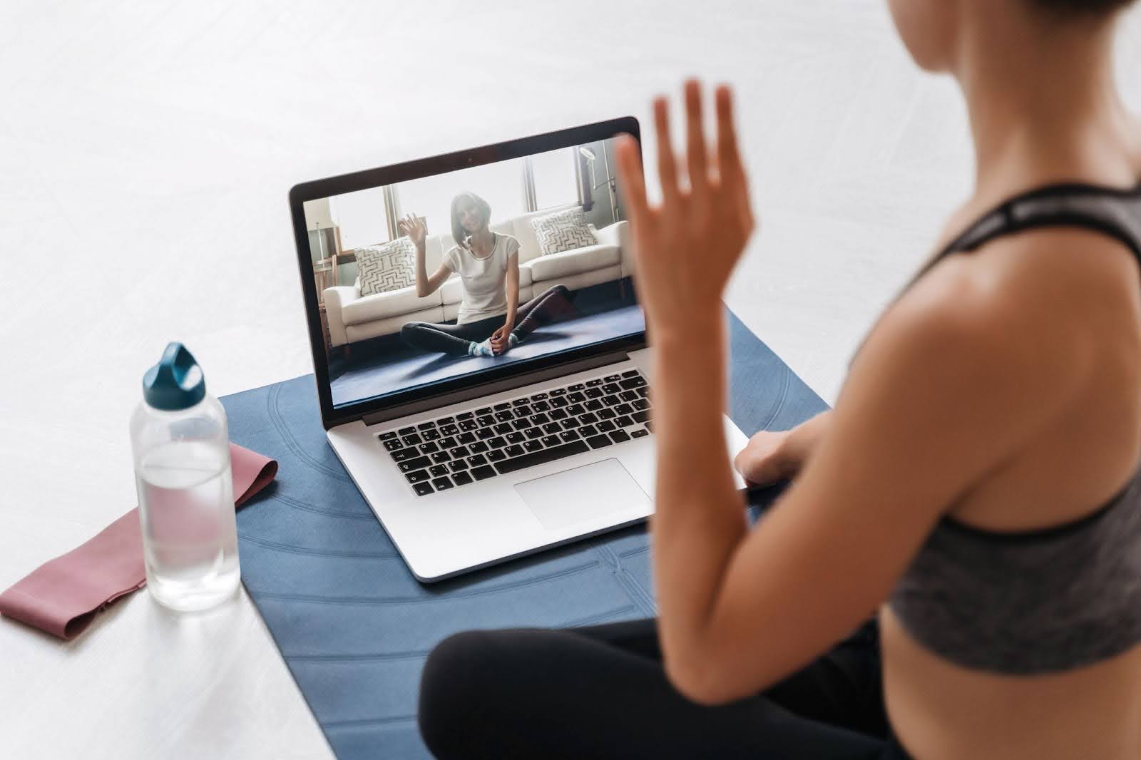 Photo of a virtual fitness coach talking with a client