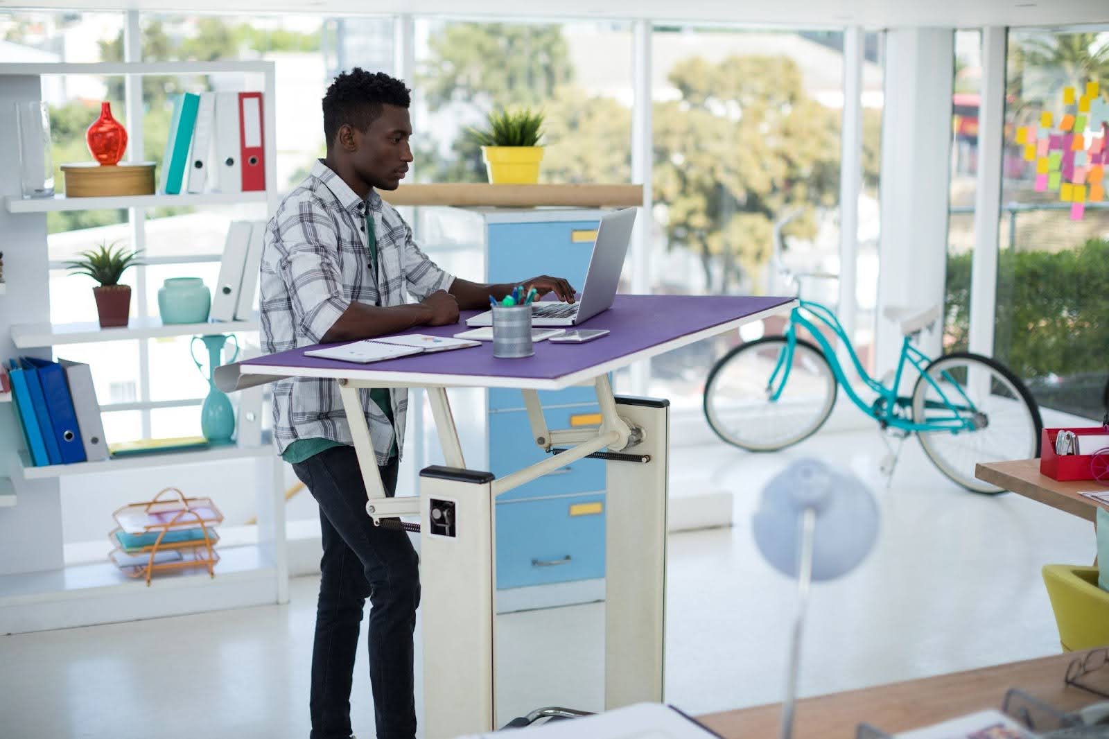 Man using a standing desk at work