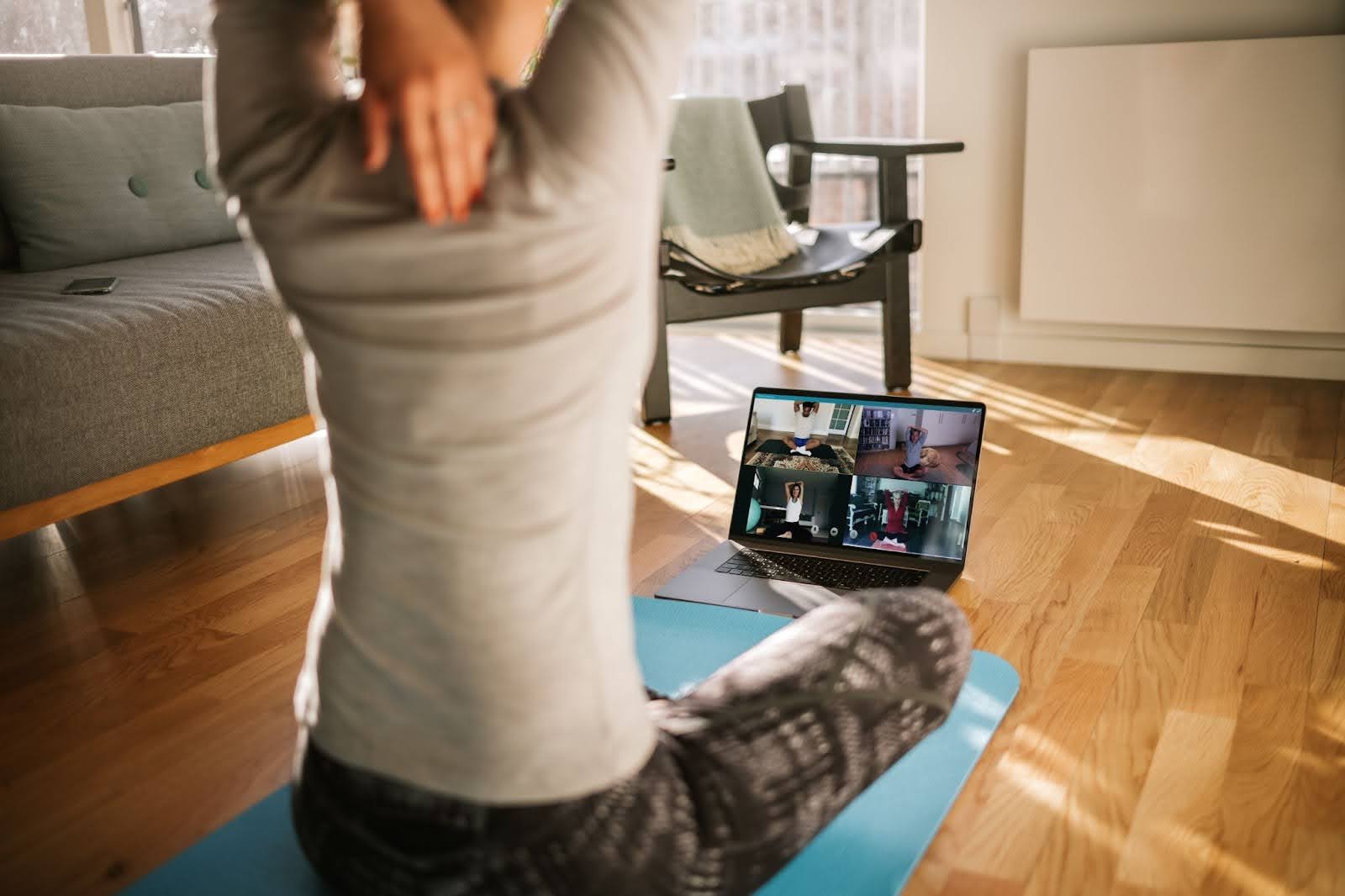 Person participating in a live Q&A with a virtual fitness program