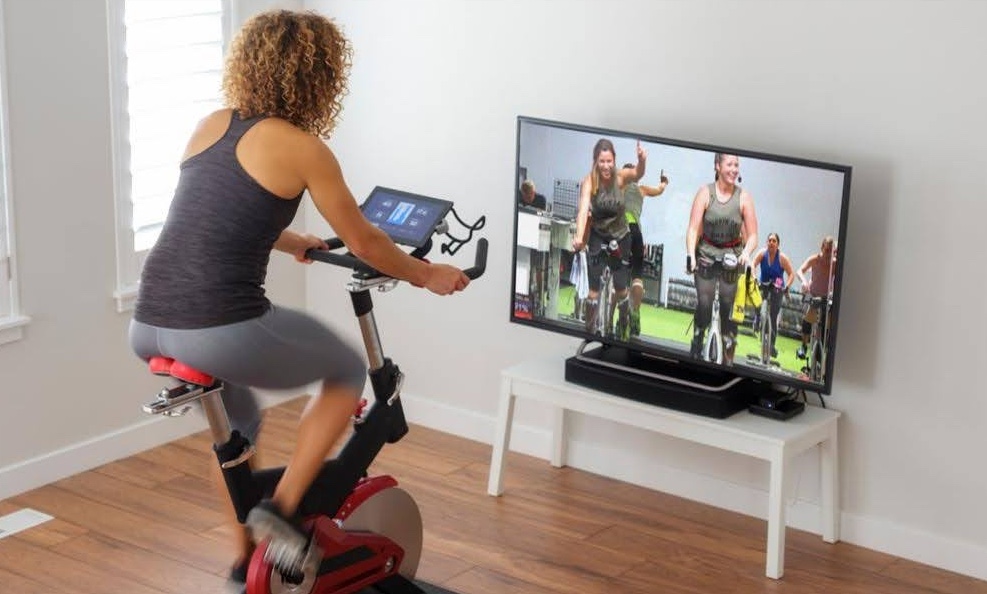 Picture of a person taking a Studio SWEAT onDemand fitness class at home