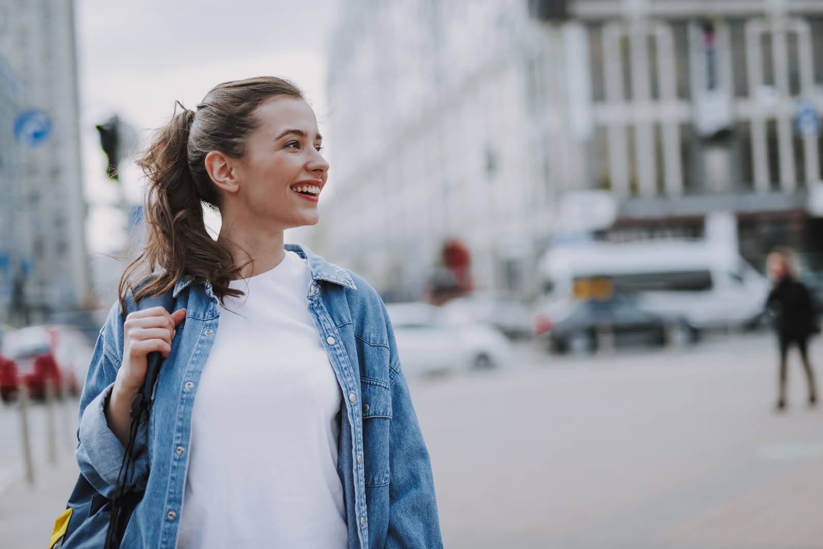 Young, attractive women walking around in her city